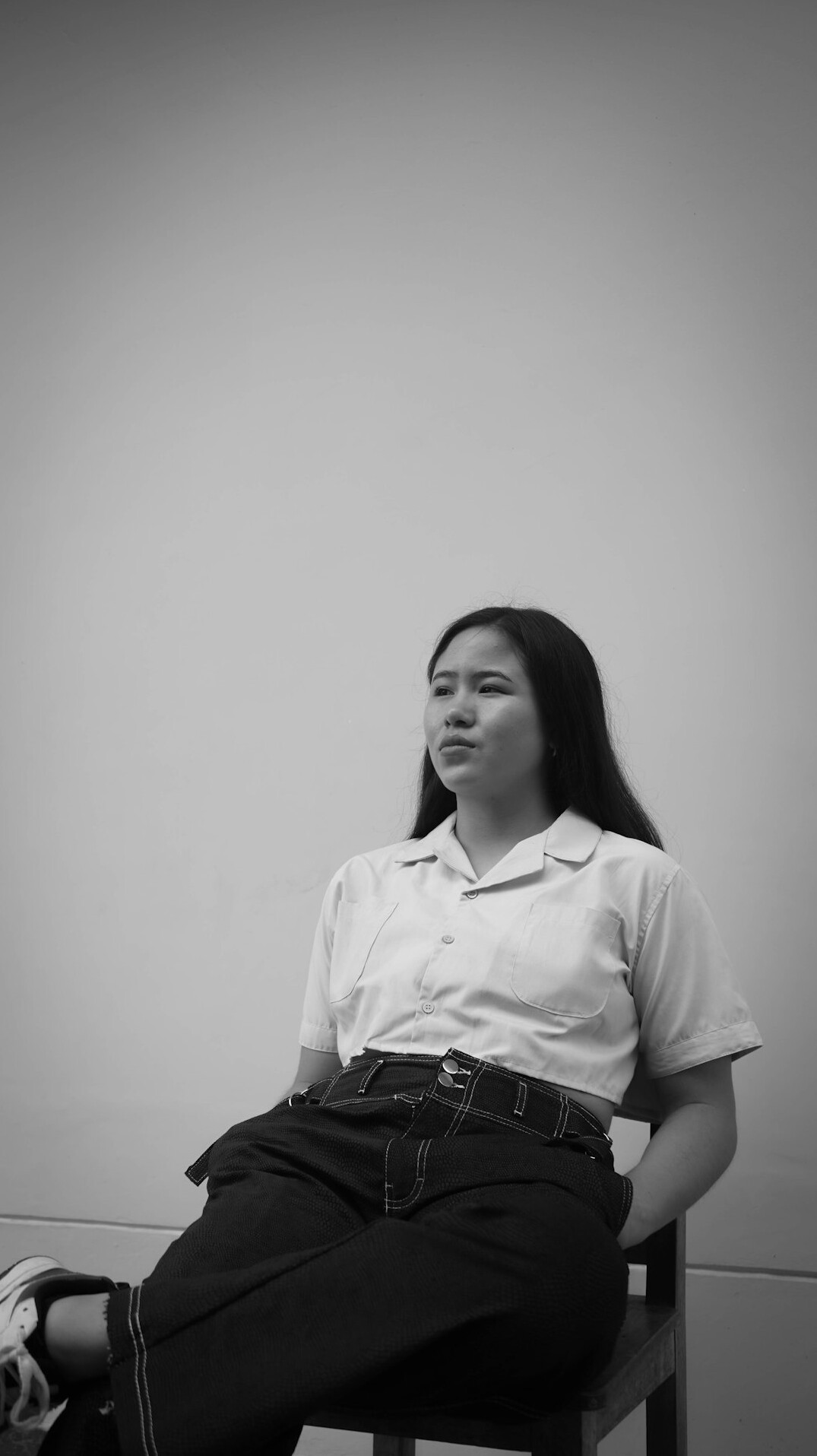 Studio portrait of a smiling Singaporean woman in professional attire