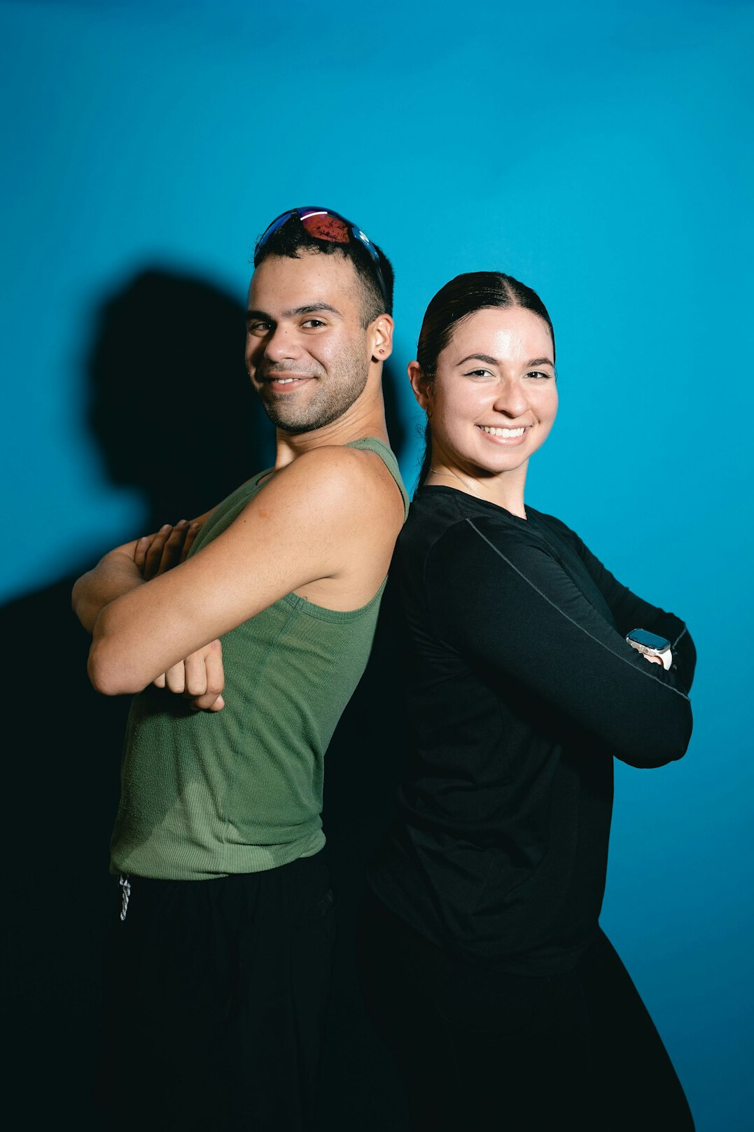 Health instructor smiling confidently with arms crossed