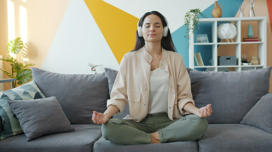 Woman practicing mindfulness meditation in a calm therapy room