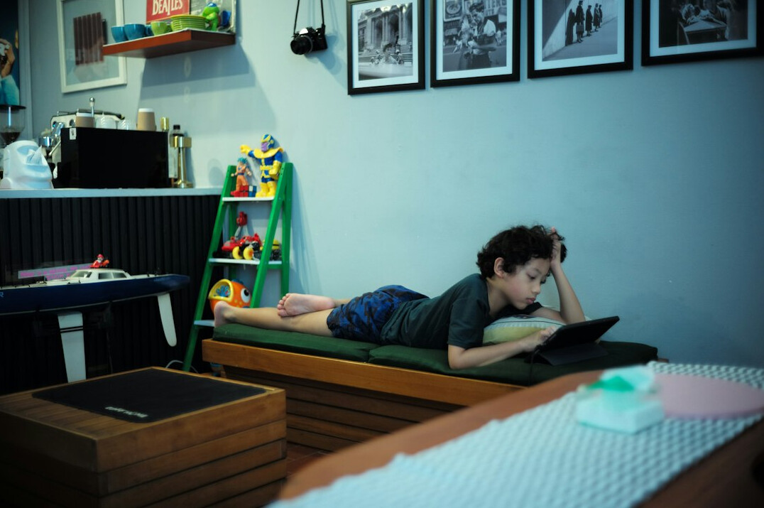 Student taking an online health course on a laptop at home